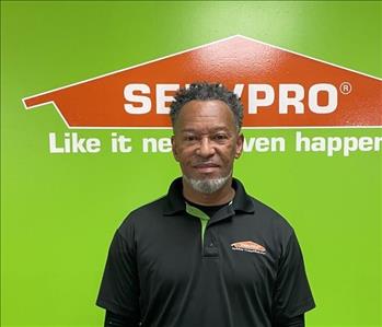 Charles, warehouse manager, pictured in front of SERVPRO background