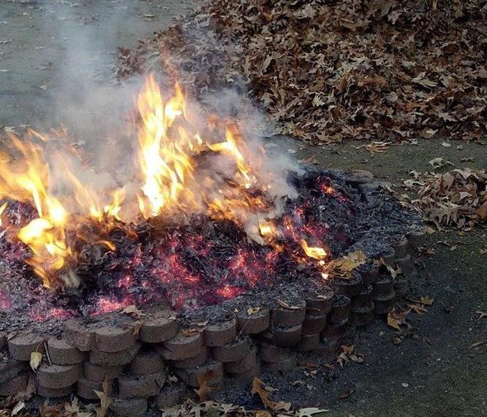 fire pit near pile of leaves